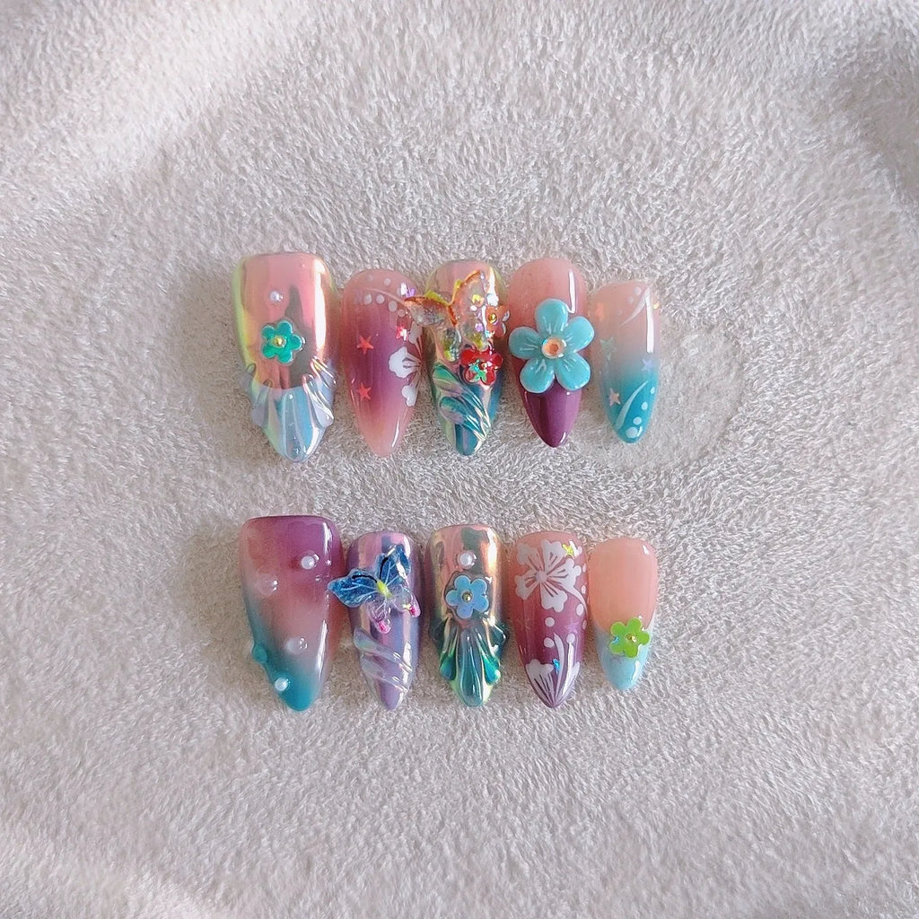 Handmade acrylic press-on nails with colourful 3D embossed flower and butterfly sculptures in almond shape.