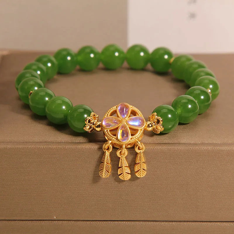 Green jasper crystal bracelet for women with four-leaf clover dream catcher pendant.
