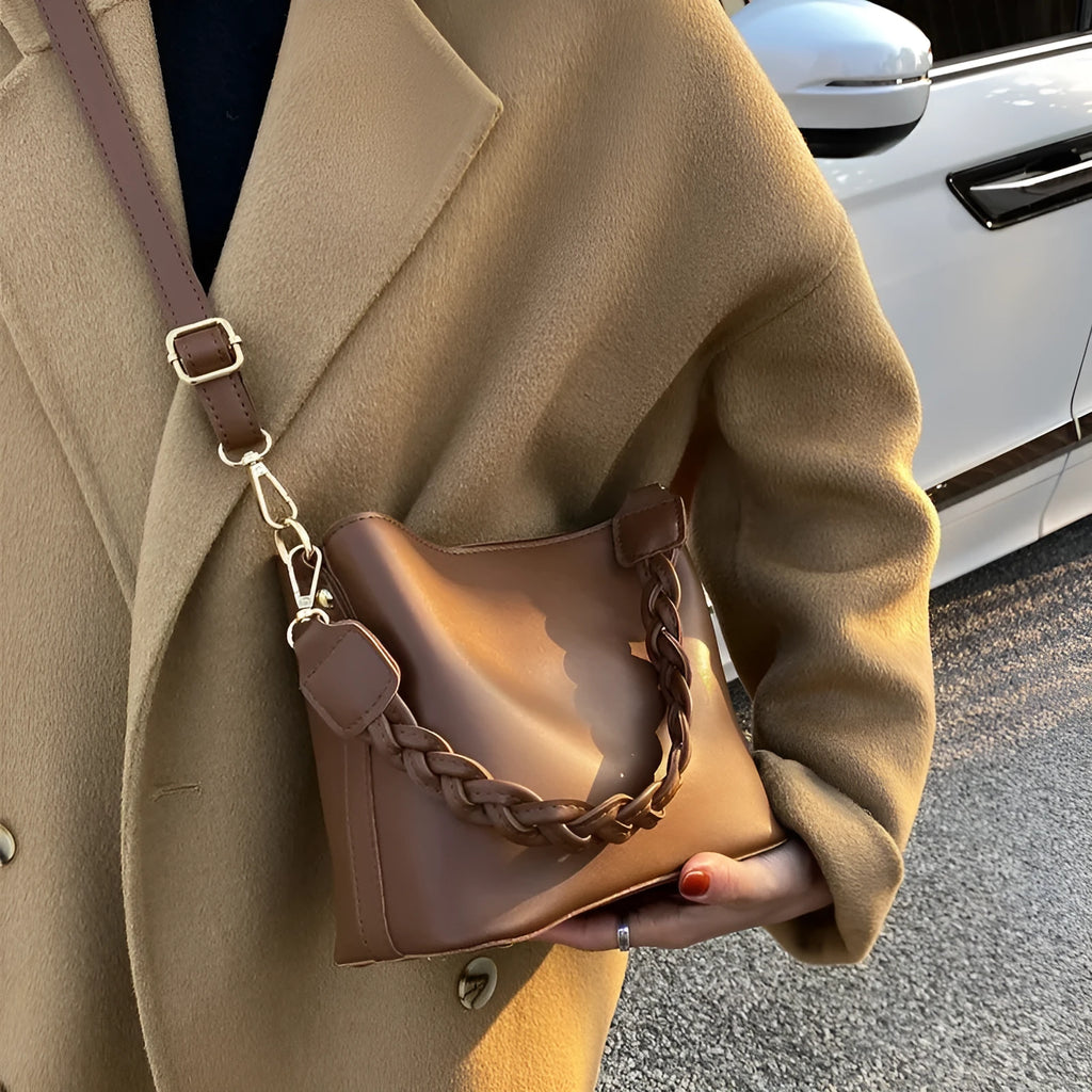 Retro-style khaki PU underarm bucket bag with a woven pattern and a crossbody strap.