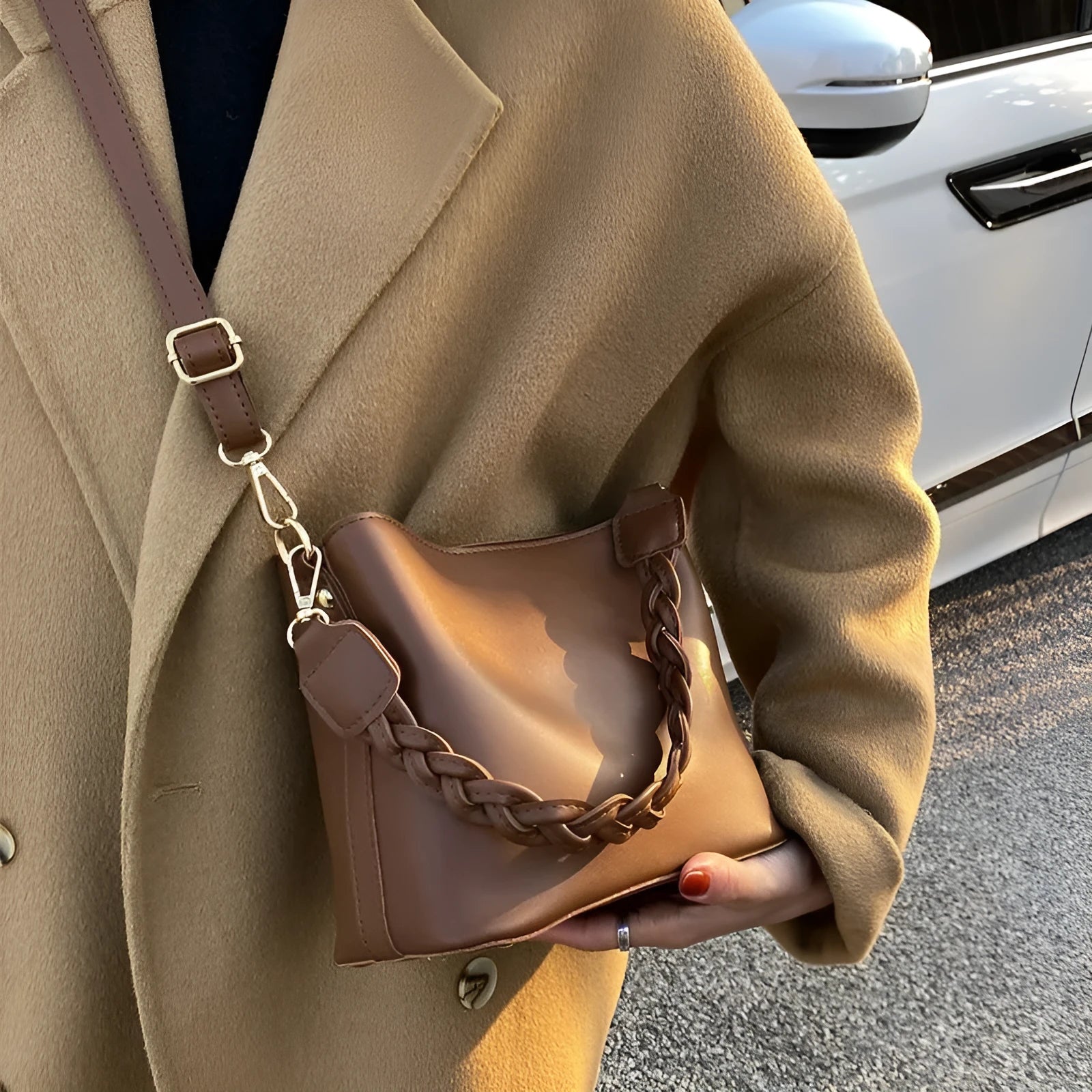 Retro-style khaki PU underarm bucket bag with a woven pattern and a crossbody strap.
