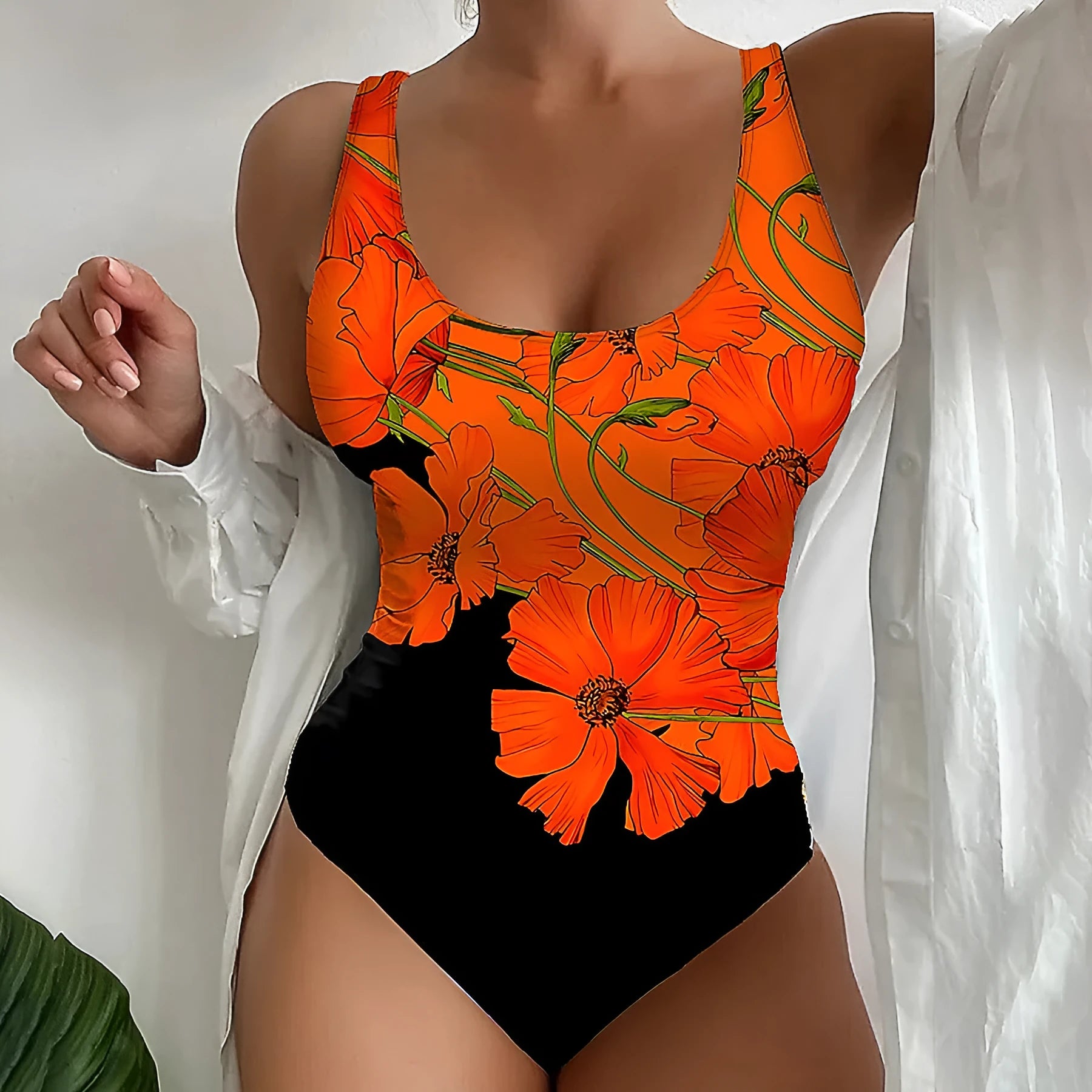 Orange floral print backless one-piece swimsuit on a hanger, slim fit design.