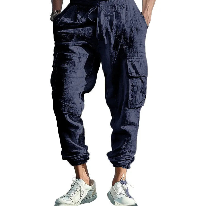 Men's casual linen trousers with ankle-tied cuffs and multi-pocket design in solid colour