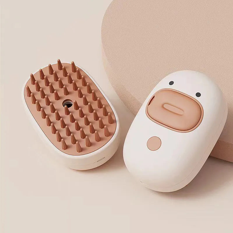White rechargeable pet steam brush with water tank for grooming dogs and cats.