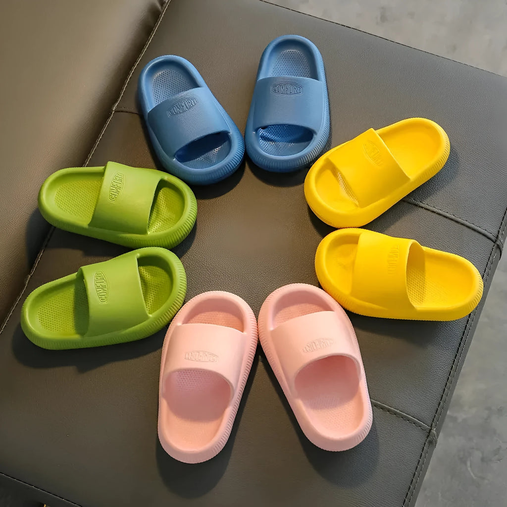 Colourful children's EVA slippers with a thick, textured non-slip sole in various sizes.