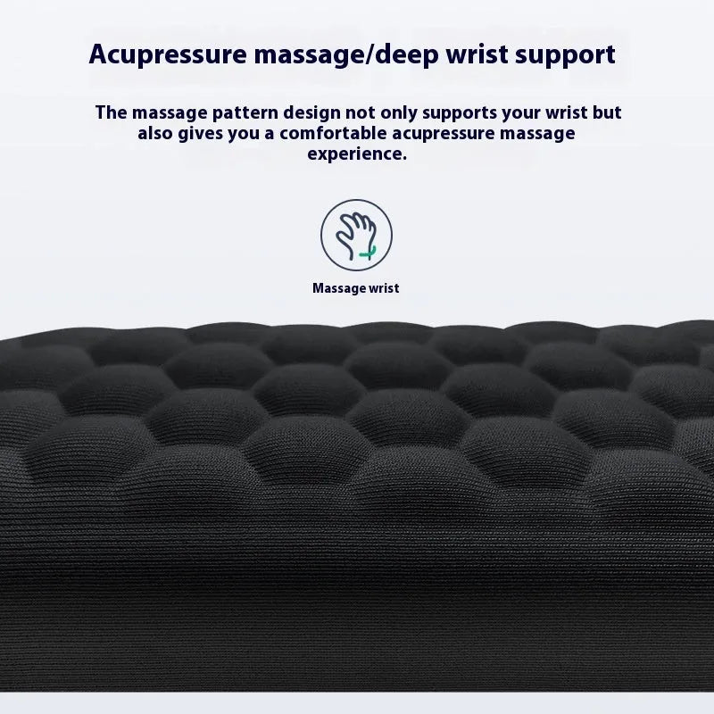 Black memory foam mouse wrist pad with silicone bottom on a wooden desk