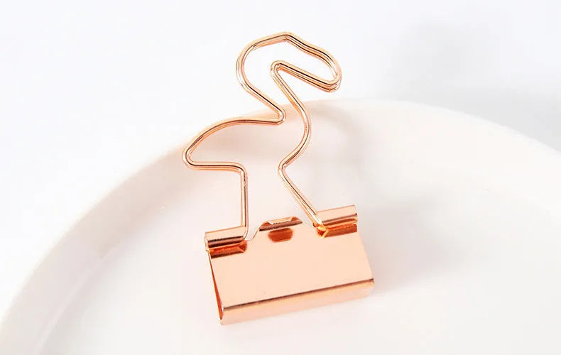Gold metal decorative paper clip showing flamingo, love, cloud, cat, cactus, and bow shape options.