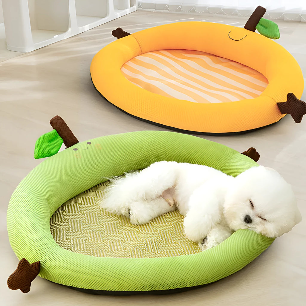Green large pet bed nest with a raised fruit-shaped backrest for dogs on a wooden floor.