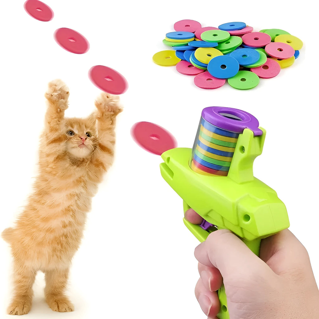 Green durable plastic battery-free cat toy launcher with a foam disc on a wooden floor.