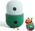 Colourful silicone dog treat puzzle ball shown in blue, green, and yellow, next to dog treats.