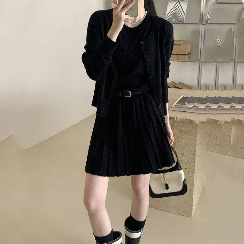 Women's grey Art Retro knitted vest skirt and long-sleeved cardigan two-piece set with pleated detail.