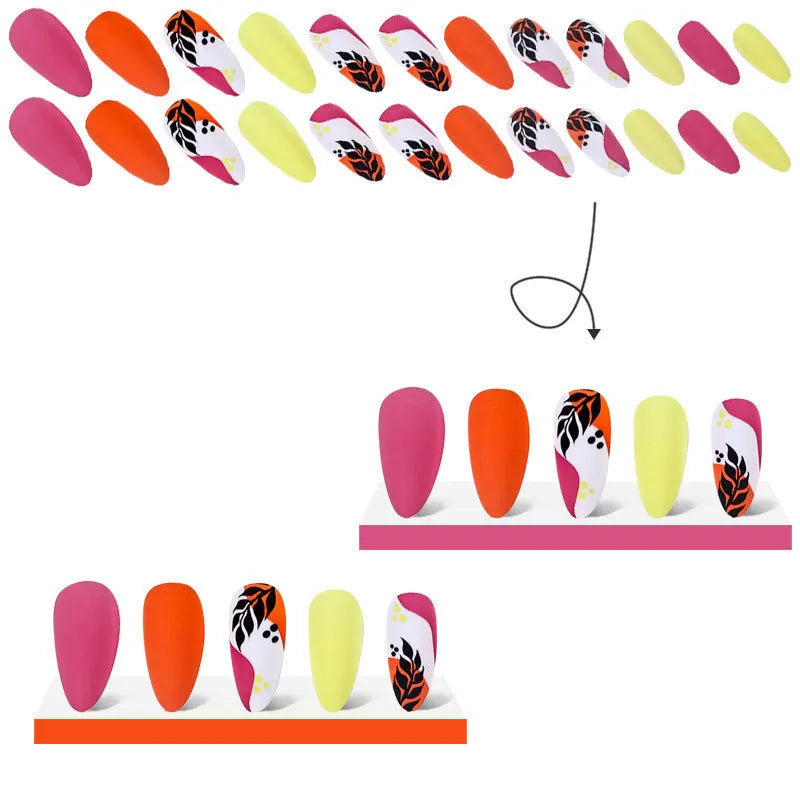 Four boxes of almond-shaped frosted nail stickers showing French leaves, leopard print, macaron and plating designs