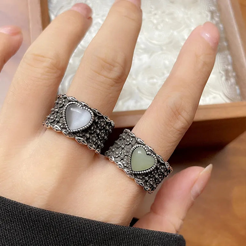 Adjustable opening heart ring in retro wide-faced moonlight style with white copper plated silver construction