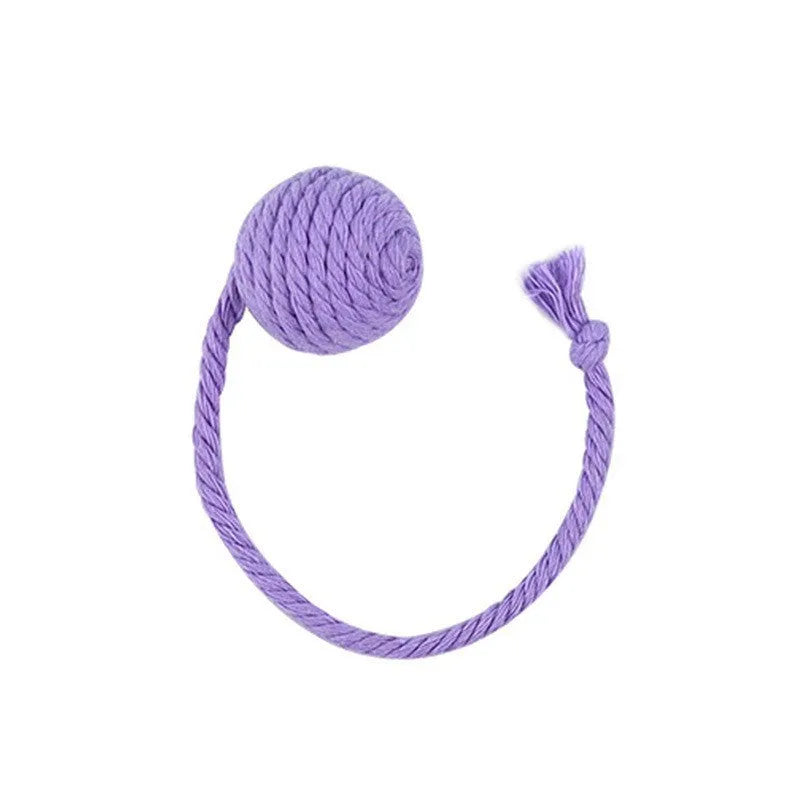 Green cat toy ball with a rope handle looped through it, shown next to a smaller pink version.