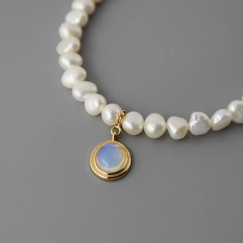 925 sterling silver necklace with geometric round medal pearl pendant on an adjustable chain.