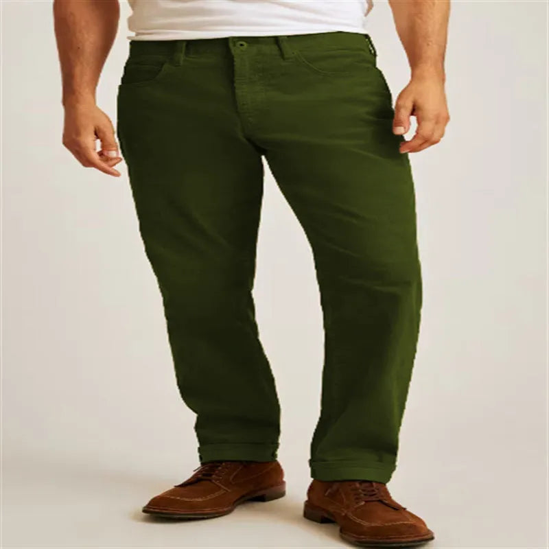 Green corduroy loose straight-leg casual trousers laid flat, showing mid-waist and zip fly detail.