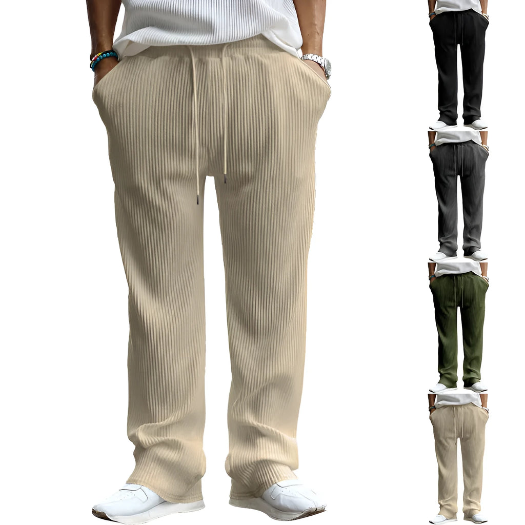 Man wearing loose-fit high-waisted straight-leg casual trousers in khaki colour.