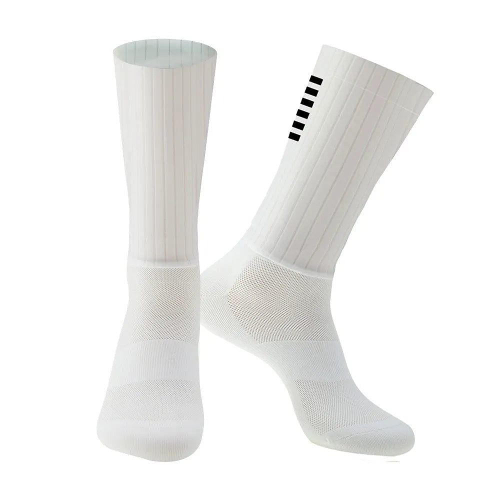 A pair of athletic cycling and running socks in a moisture-wicking fabric blend on a grey background.