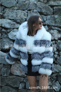 A loose-fitting women's street fashion coat with a detachable artificial fur hood.