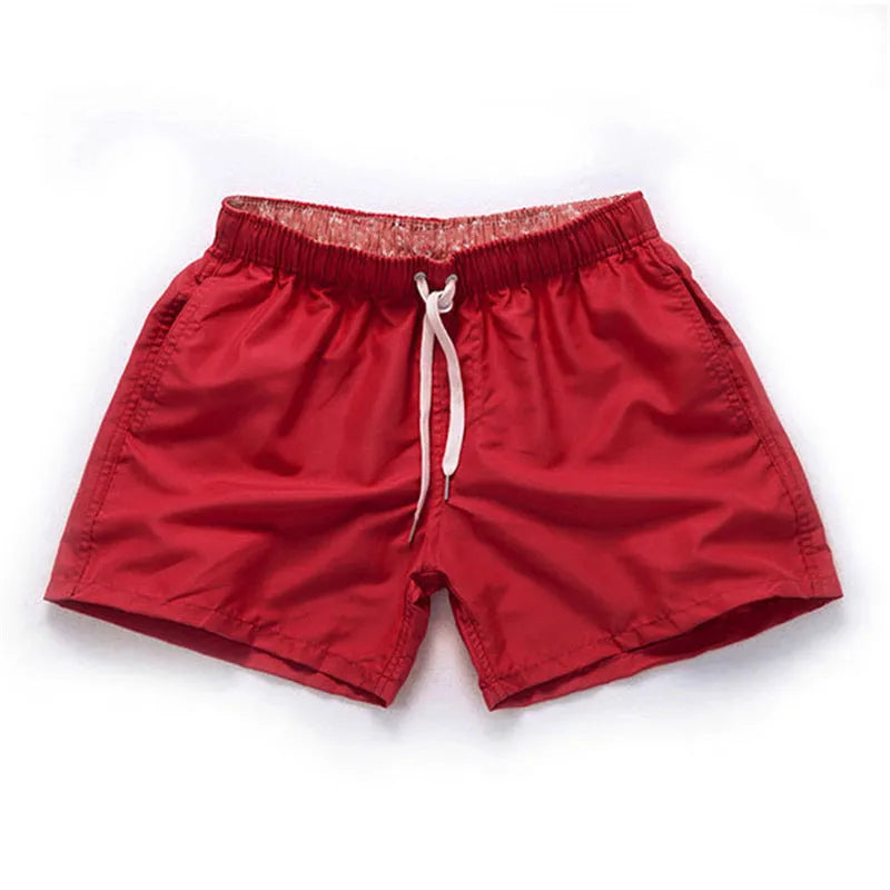 Men's polyester beach shorts in multiple colours with straight leg design for surfing and summer wear, available in sizes S to 4XL