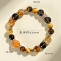 Women's natural yellow 10mm artificial crystal string beads bracelet on wrist.