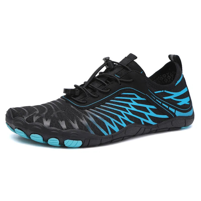 White and black lace-up casual trainers with rubber soles on a plain background