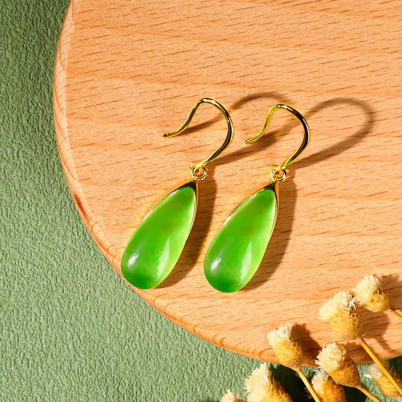 A pair of jade green retro Chinese-style geometric earrings with water droplet details.