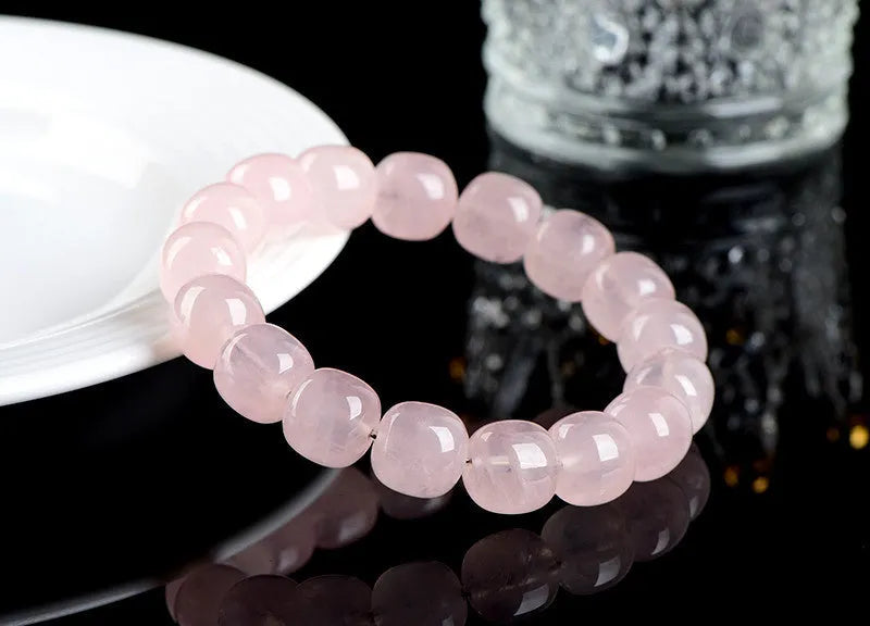 Natural bamboo crystal barrel bead bracelet with geometric pink beads measuring 11-12mm
