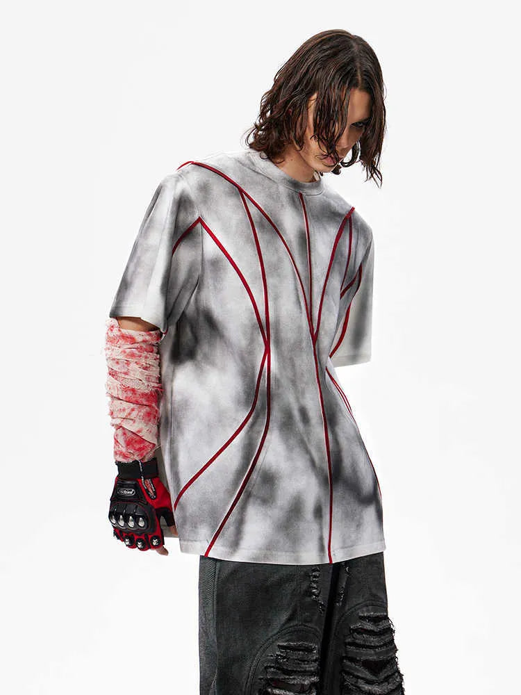 Women's short sleeve T-shirt with padded shoulders and textured 3D line patchwork detail on a round neck top.