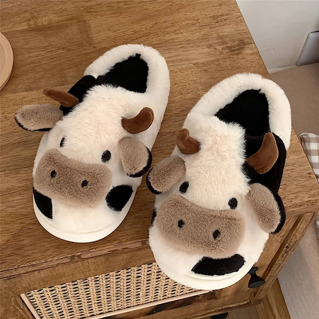 White women's cow slippers with plush faux fur upper and textured non-slip soles