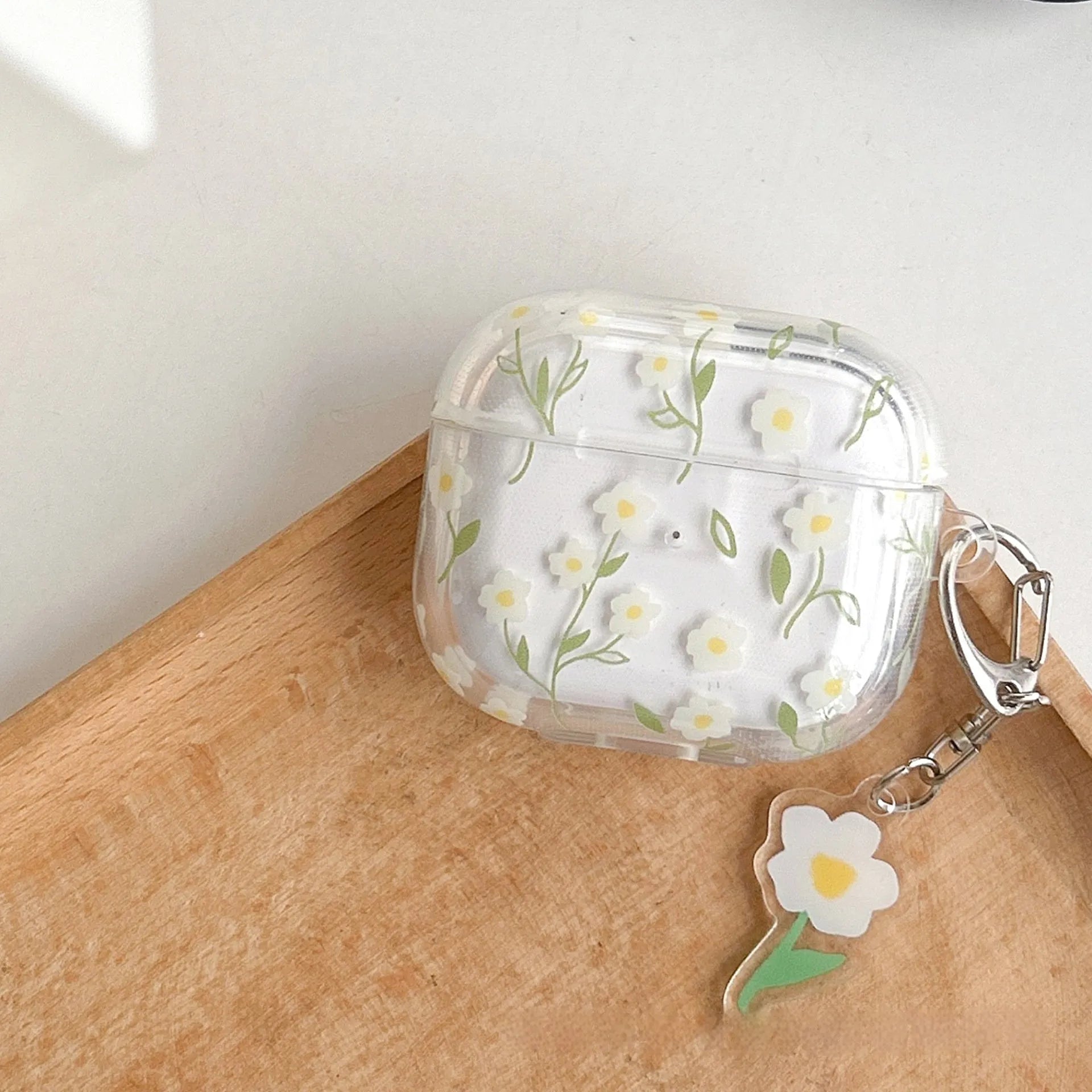 Transparent TPU AirPods case cover with white floral design showing compatibility with multiple Apple AirPods models