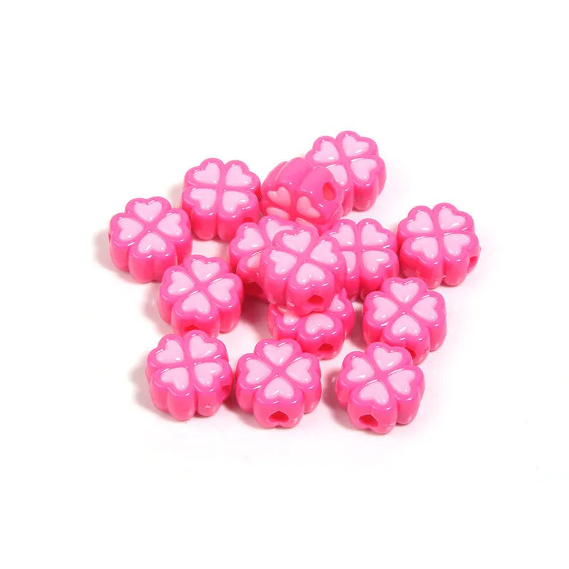 Assorted light-coloured acrylic clover-shaped beads with frosted finish, 15mm size.