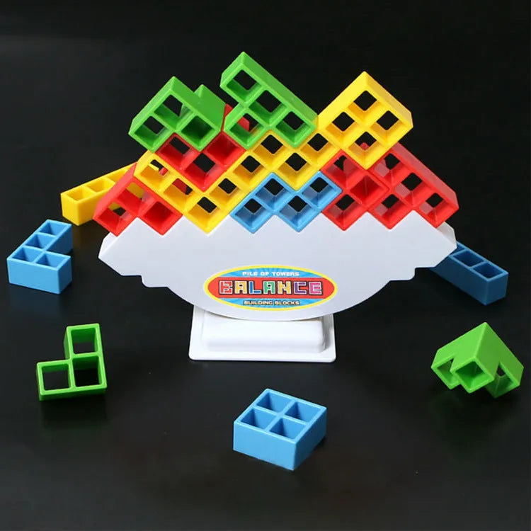 Plastic balance stacking game with 16 coloured building blocks on chassis