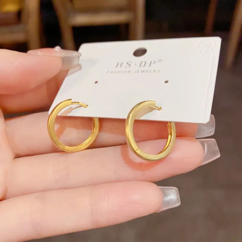 Geometric circle ear clip in gold finish with real gold plating on copper material