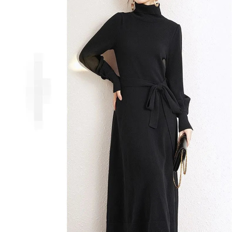 Rose red turtleneck knit dress with long sleeves, elastic waist, and a loose flowing mid-length skirt.