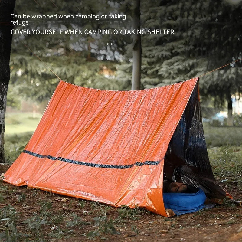 Orange portable disaster relief tent kit with sleeping bag and emergency blanket for outdoor emergencies