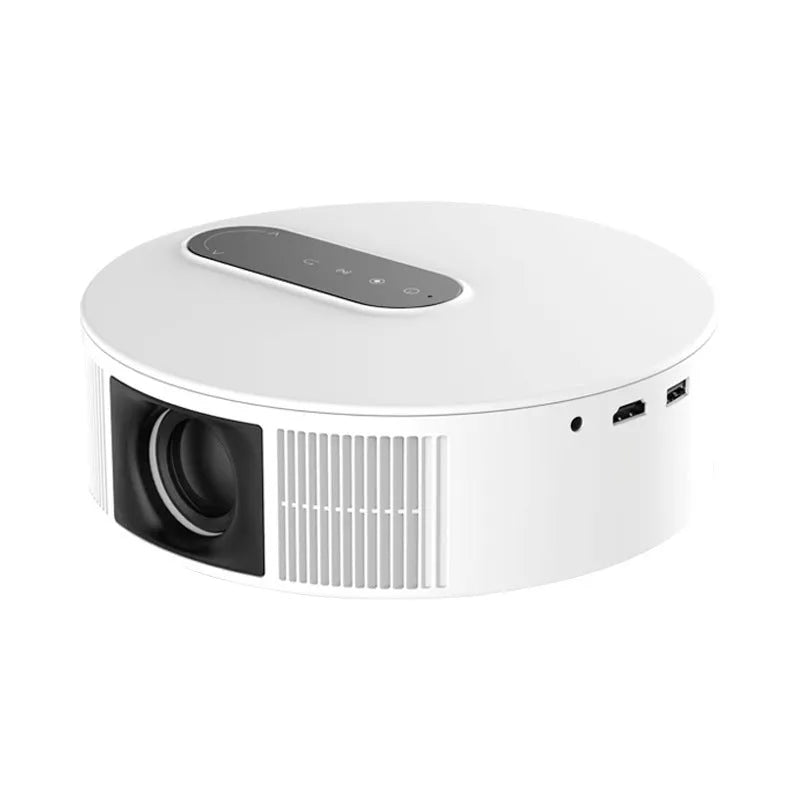 White HD home projector with remote control on a table.