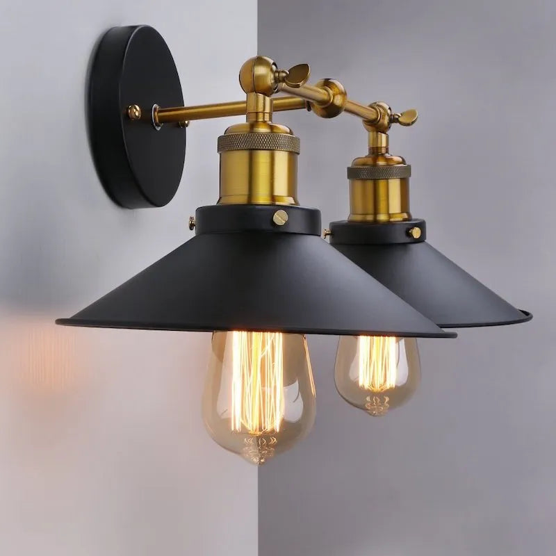 Black iron retro industrial style wall lamp with two adjustable light heads.