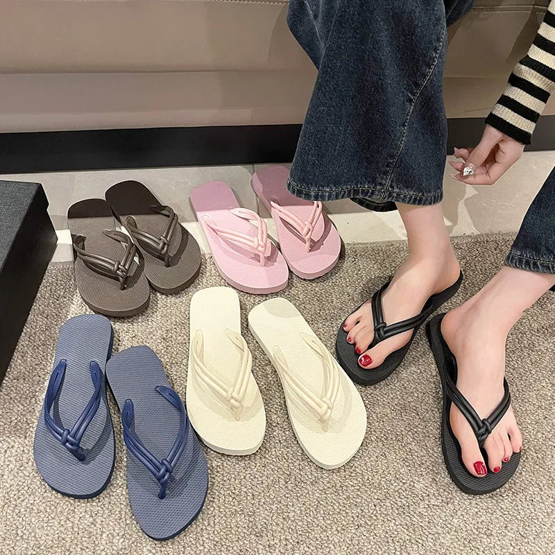 Men's casual flip flops with toe covering in PVC material, showing non-slip sole pattern and full foot enclosure design