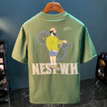 Green men's oversized t-shirt with a printed graphic design and short sleeves on a hanger