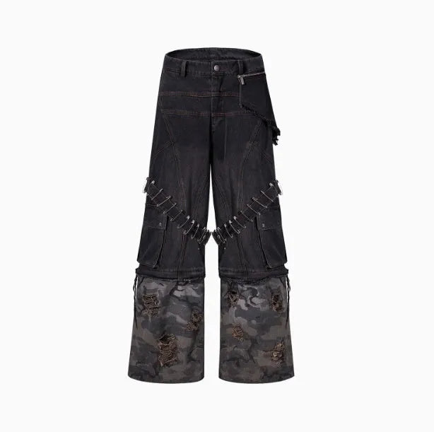 Grey men's jeans with camouflage pattern splicing and silver pin and black ribbon detailing on the legs.