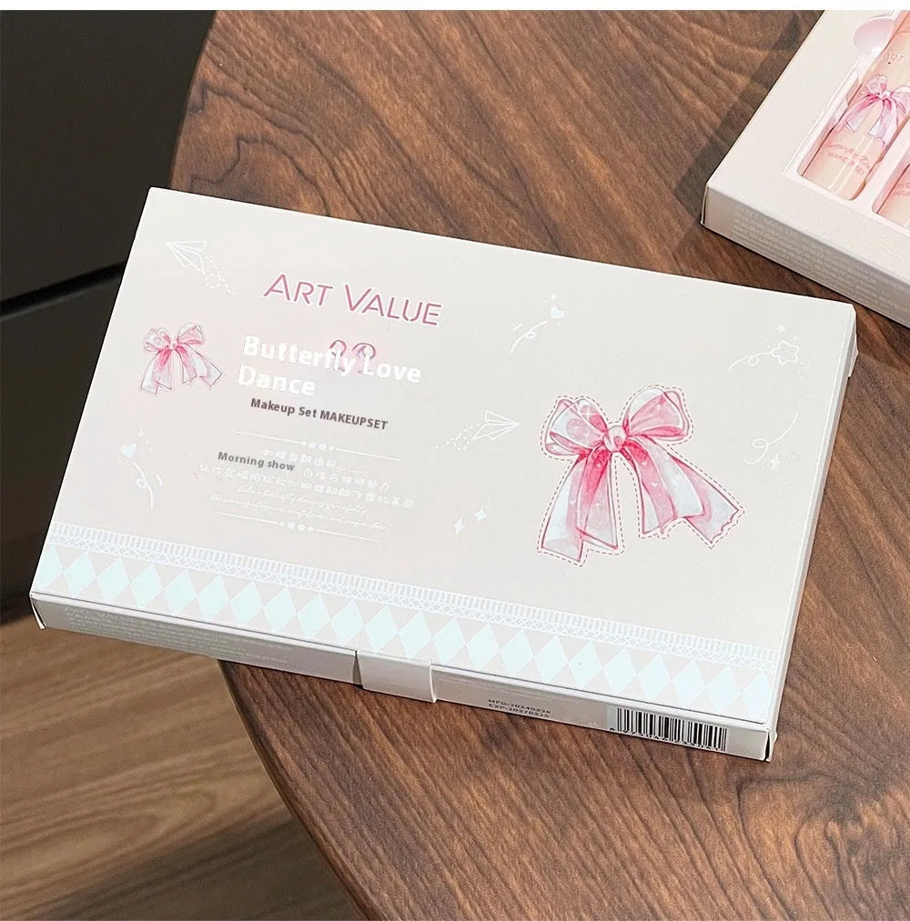Butterfly box makeup set containing four matte lip mud tubes, powder blusher compact and adjustable necklace