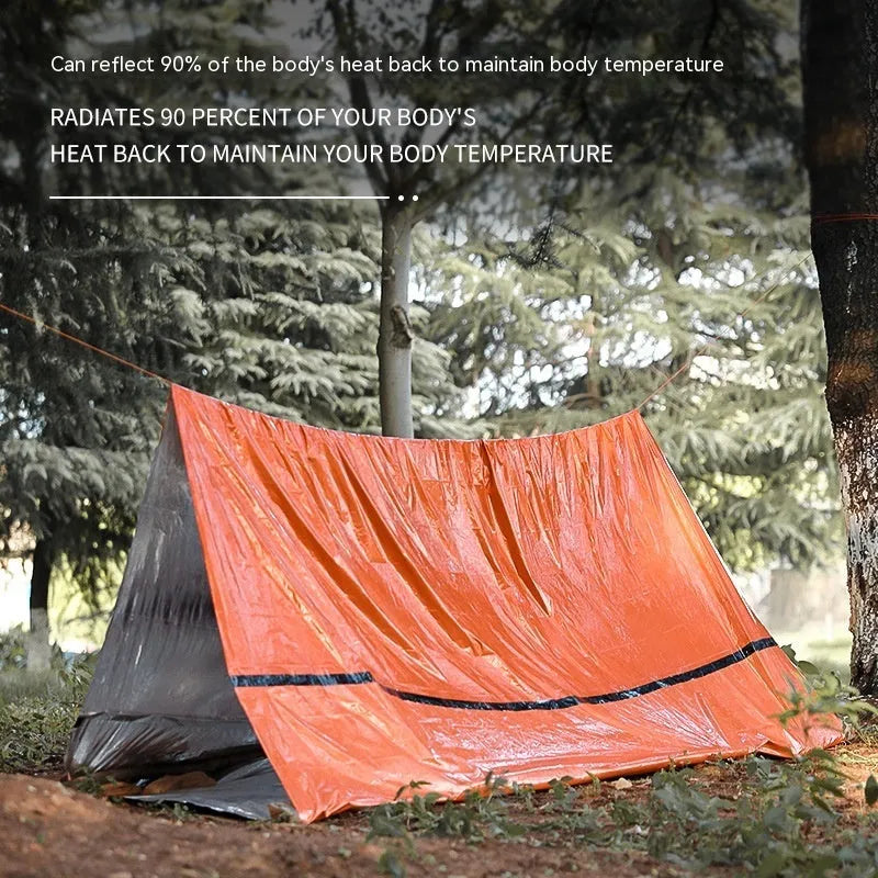 Orange portable disaster relief tent kit with sleeping bag and emergency blanket for outdoor emergencies