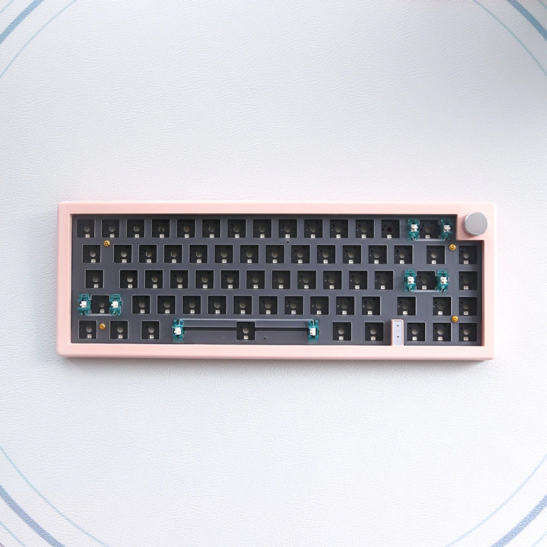 DIY mechanical keyboard kit with RGB lighting and rotary knob in seven colour options