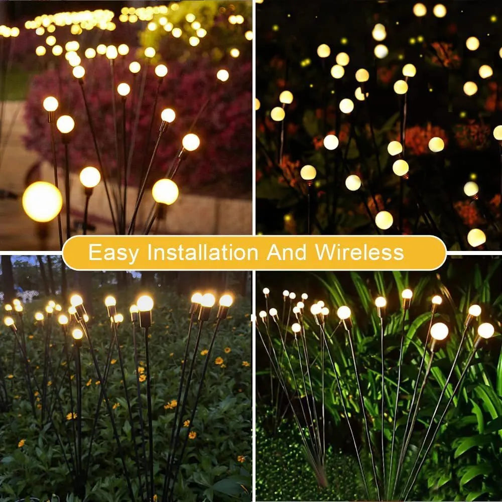 Solar-powered LED firefly garden spike light with stainless steel ground stake illuminated at dusk.
