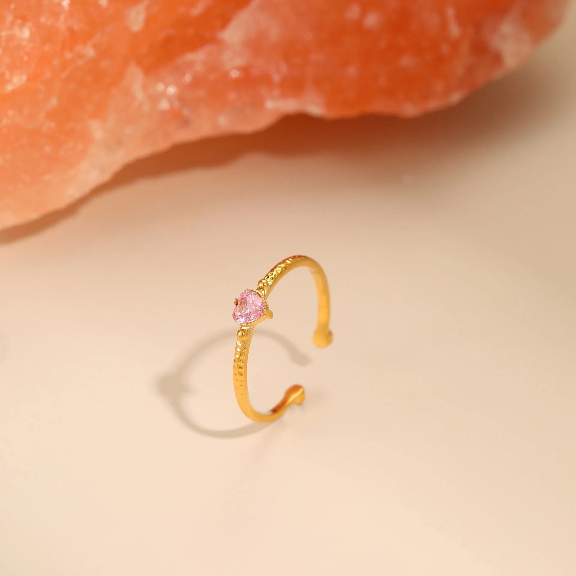 Open ended stainless steel ring with heart shaped zircon inlay in geometric design