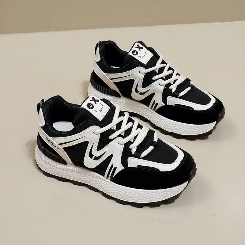 Women's black platform sports casual shoes with round toe and front lace-up closure on flat background