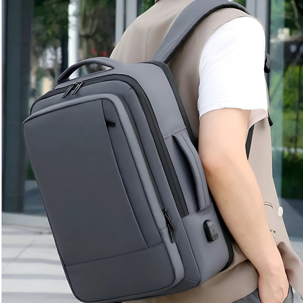Black or grey waterproof Oxford cloth backpack with curved shoulder straps showing business and outdoor use
