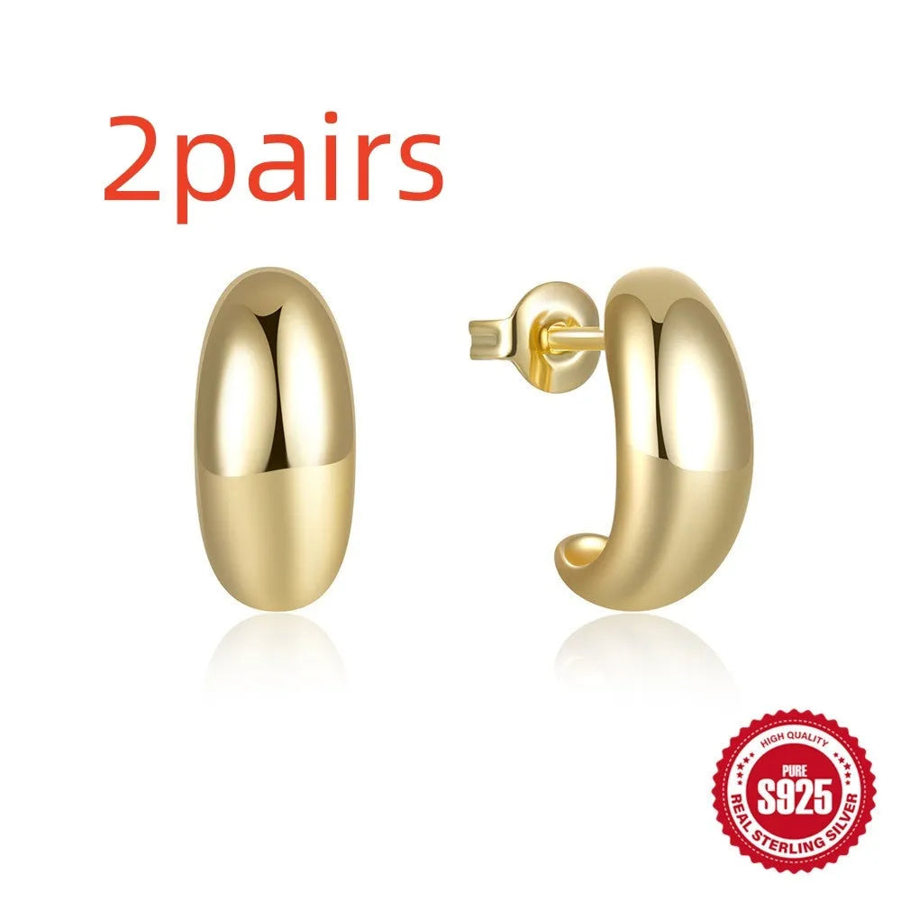 C-shaped sterling silver stud earrings with gold electroplated finish