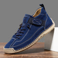 Men's mid-top Martin boot in khaki with tooling stitching and elastic band fastening.