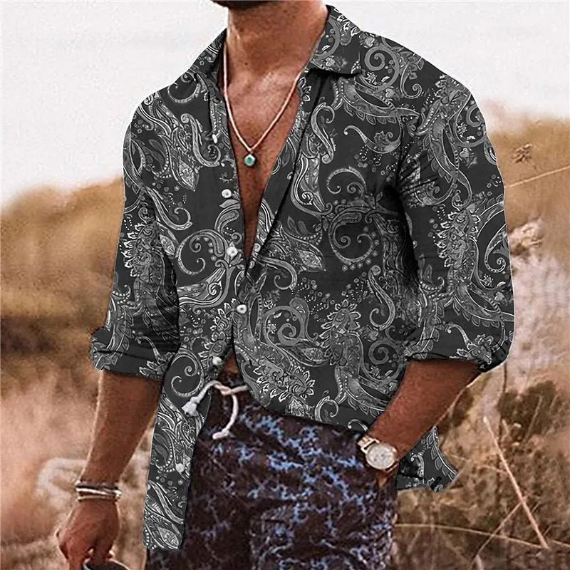 Man wearing a loose-fit long sleeve shirt with a colourful bohemian floral 3D print pattern.